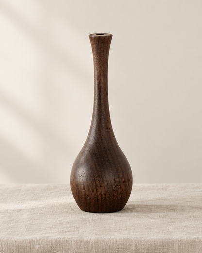Slim Dark Wood Bottle Vase, shown alone on a linen background