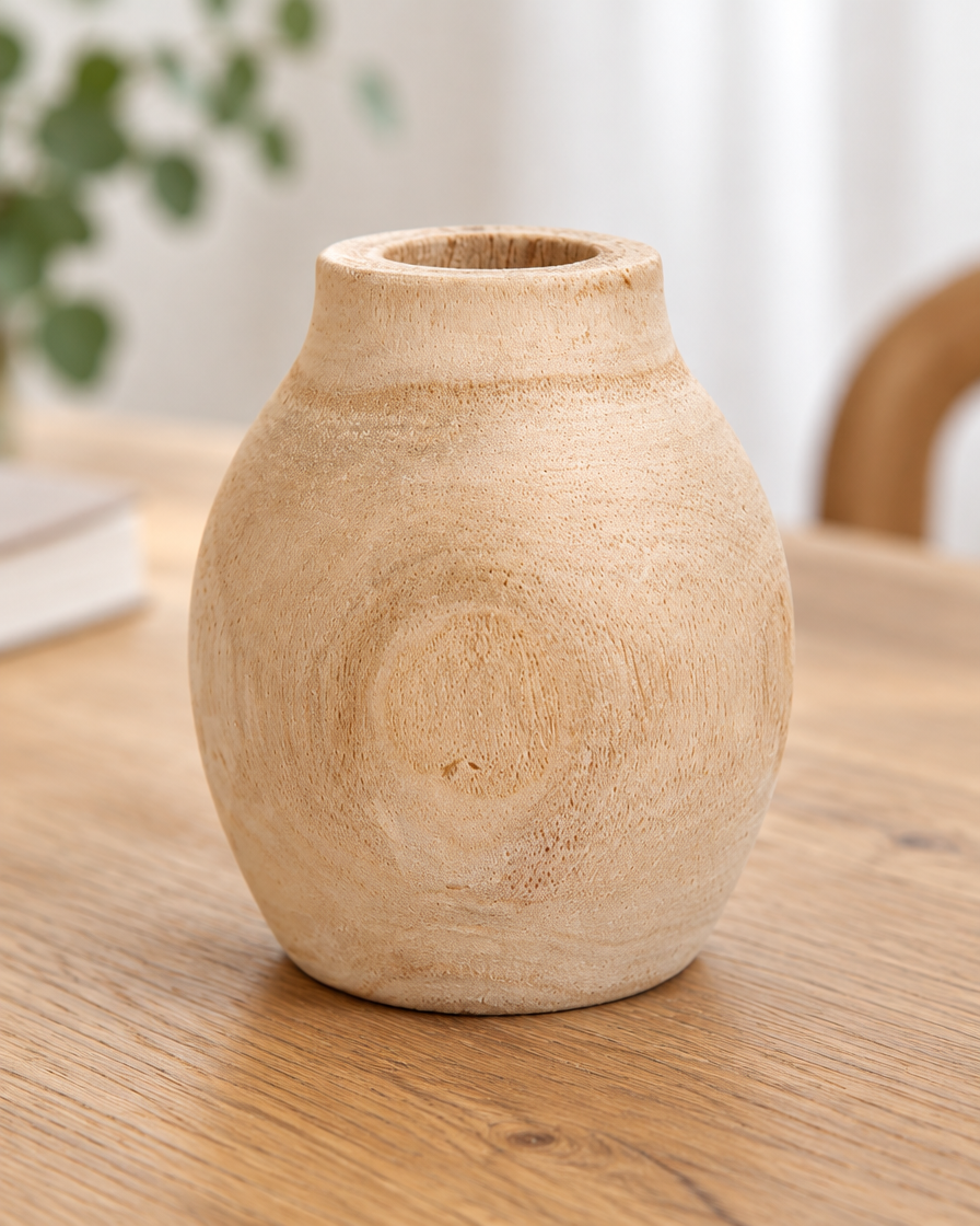 Close-up of the finish of the round natural wood vase
