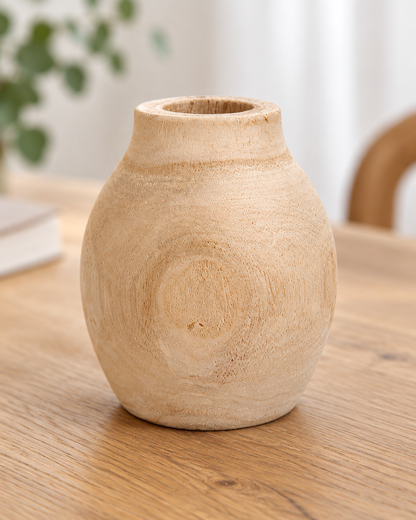 Close-up of the finish of the round natural wood vase