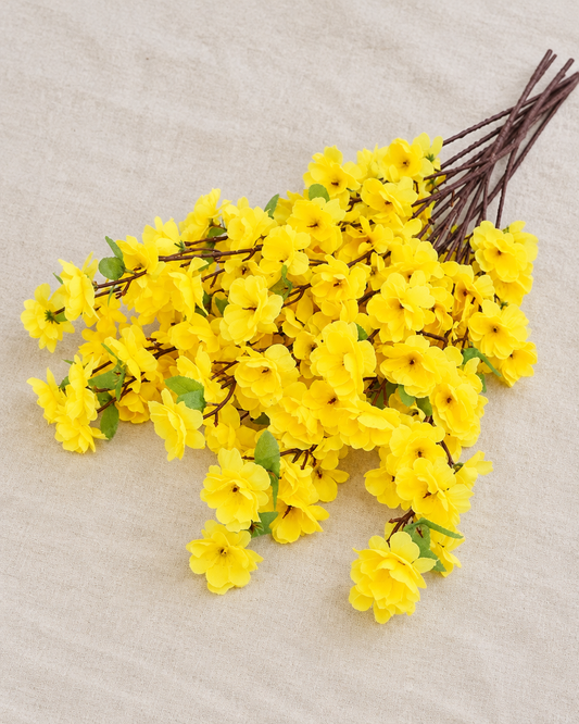 Yellow Artificial Blossom Branches, shown alone on a linen background