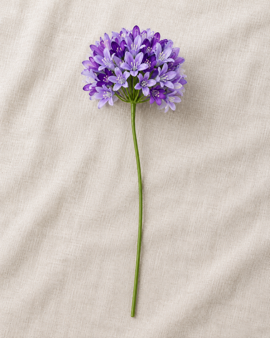 Purple Artificial Agapanthus Stem, shown alone on a linen background