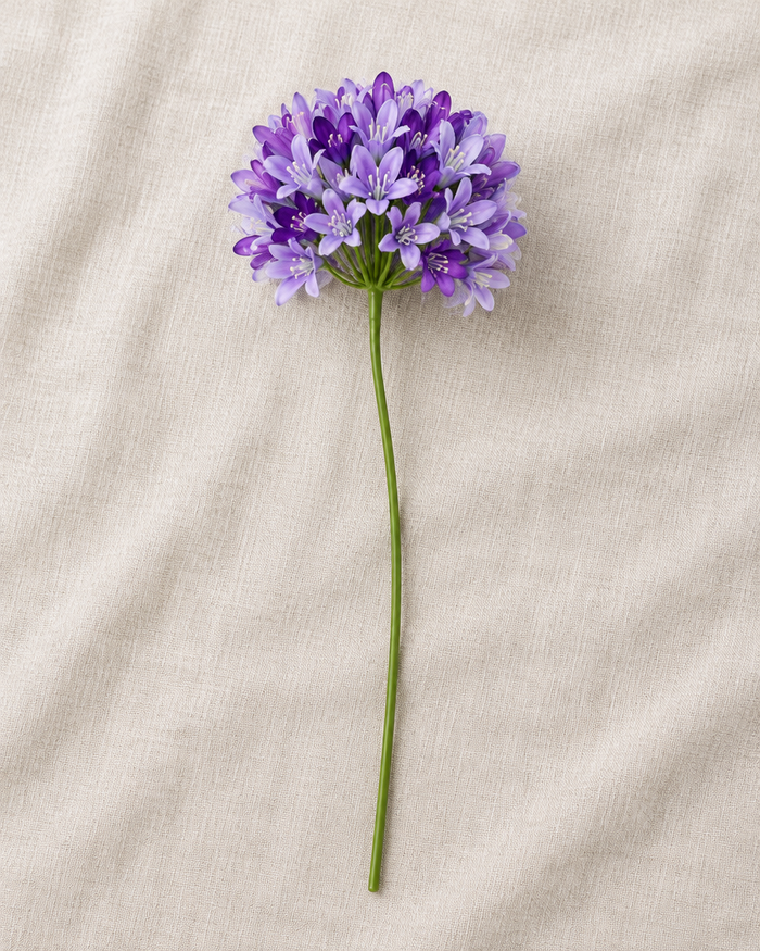 Purple Artificial Agapanthus Stem, shown alone on a linen background