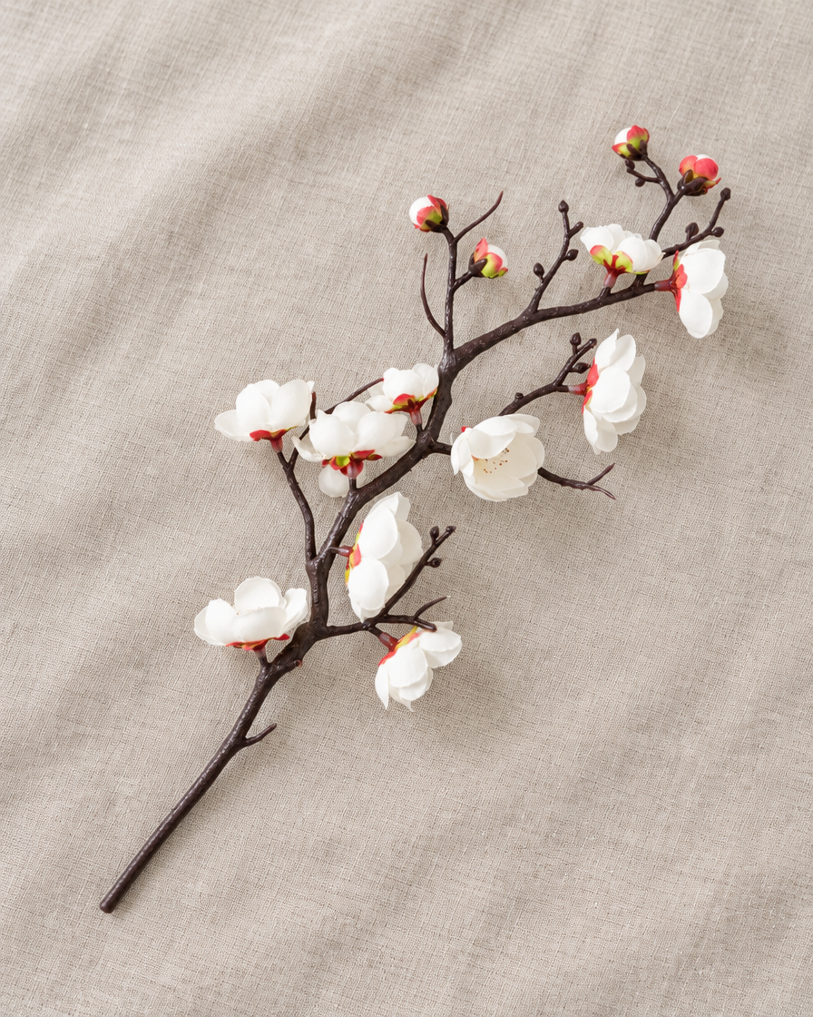 White Artificial Plum Blossom Single Branch, shown alone on a linen background